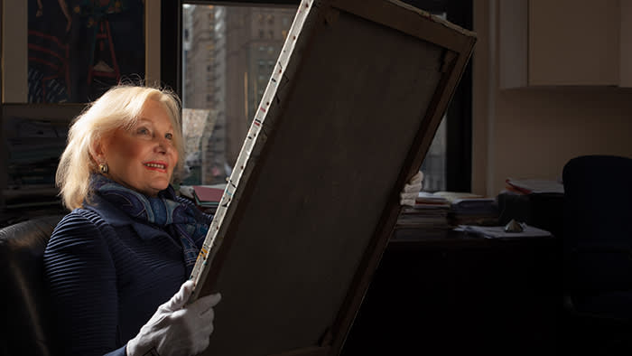 Sharon Flescher, IFAR executive director, examines a work allegedly by Jackson Pollock
